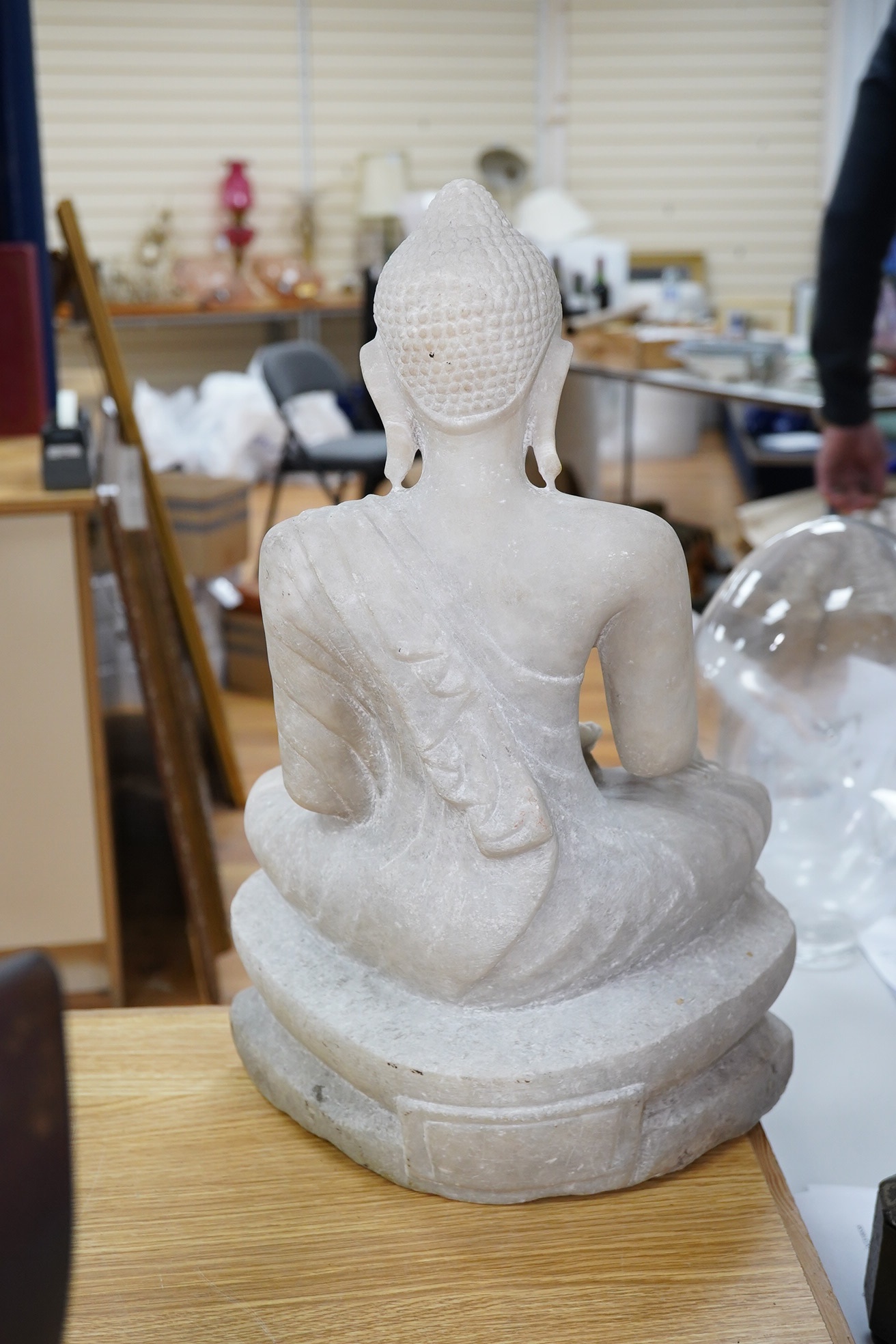 A 19th century Burmese alabaster model of a seated Buddha, 45cm. Condition - fair to good